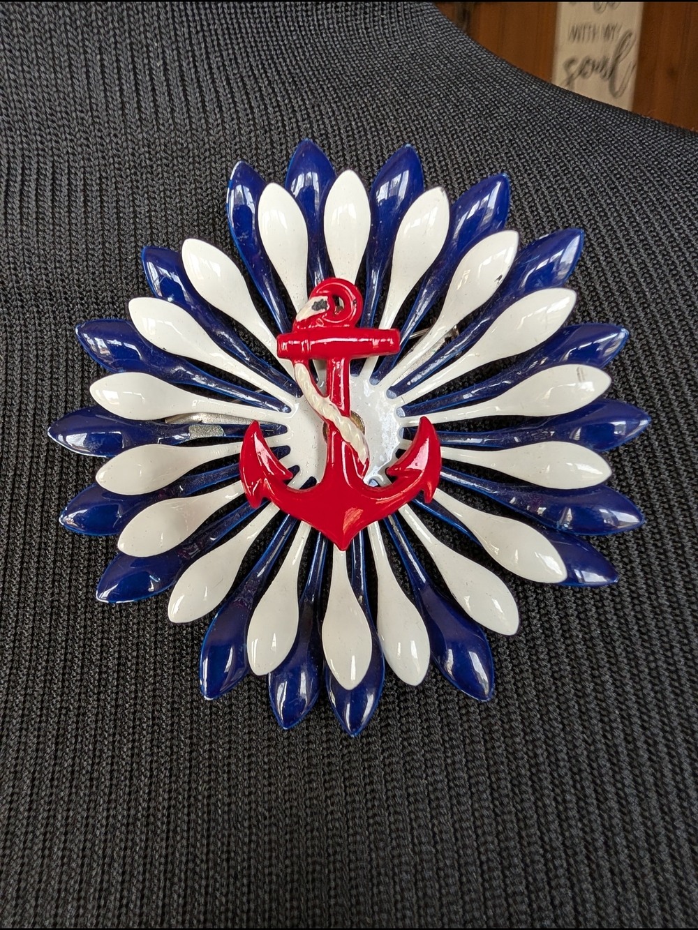 Nautical Red Anchor Brooch with Blue and White Petal Design